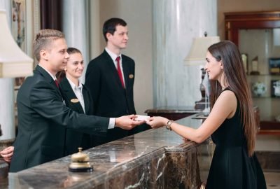 Picture of guests getting key card in hotel